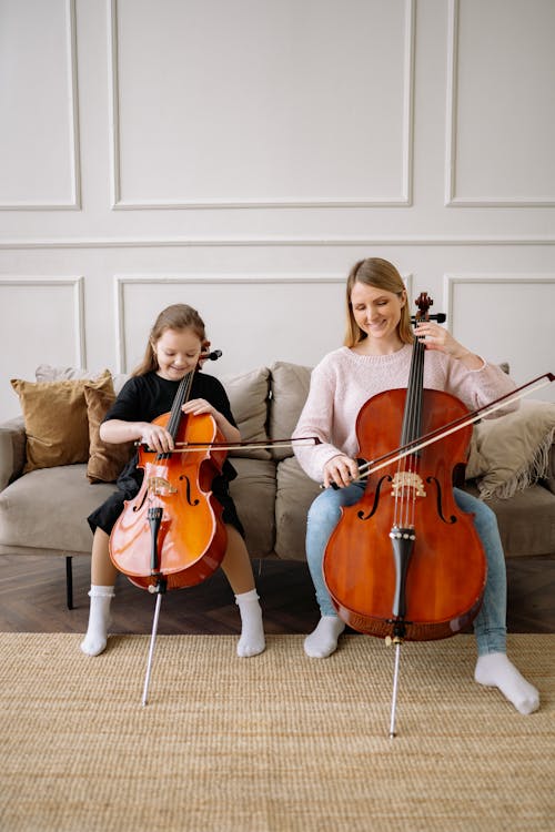 A Woman and a Girl Playing Cello