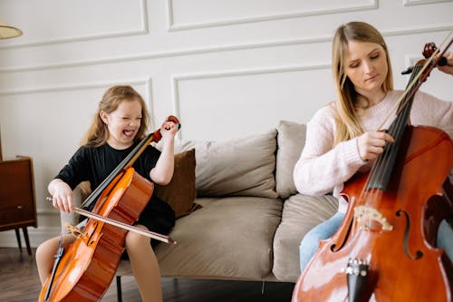 A Woman and a Girl Playing Cello