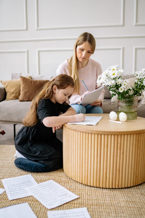 Mother Looking at her Daughter Study