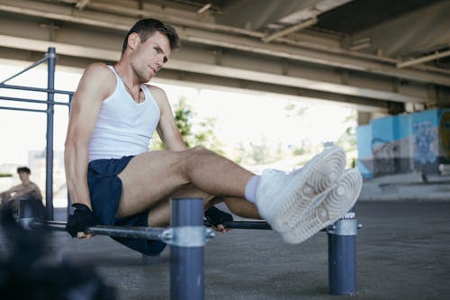 Free Man in White Tank Top Working Out Stock Photo