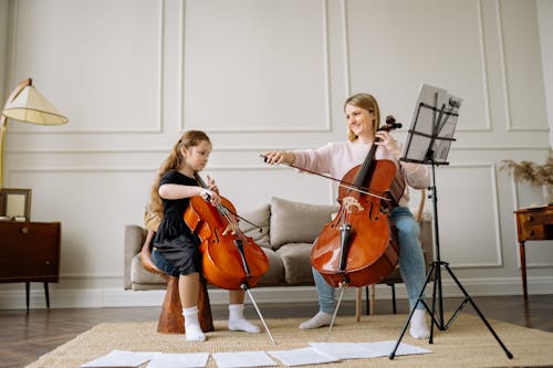 A Woman and a Girl Playing Cello