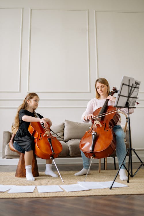 A Woman and a Girl Playing Cello