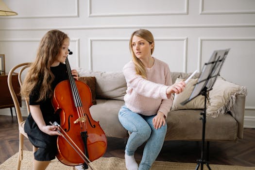 A girl receives cello lessons from a teacher in a cozy home setting.