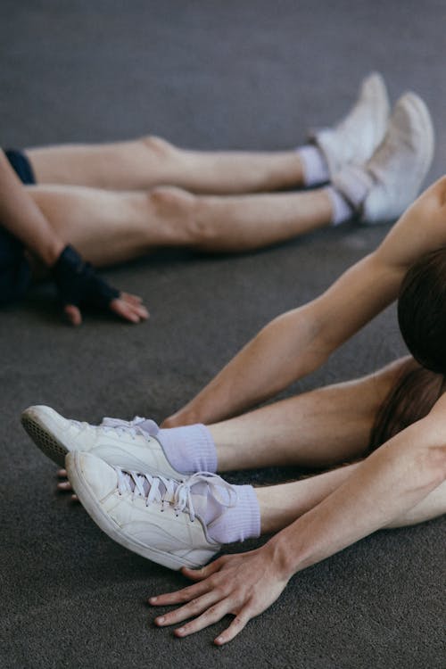 Two People Stretching