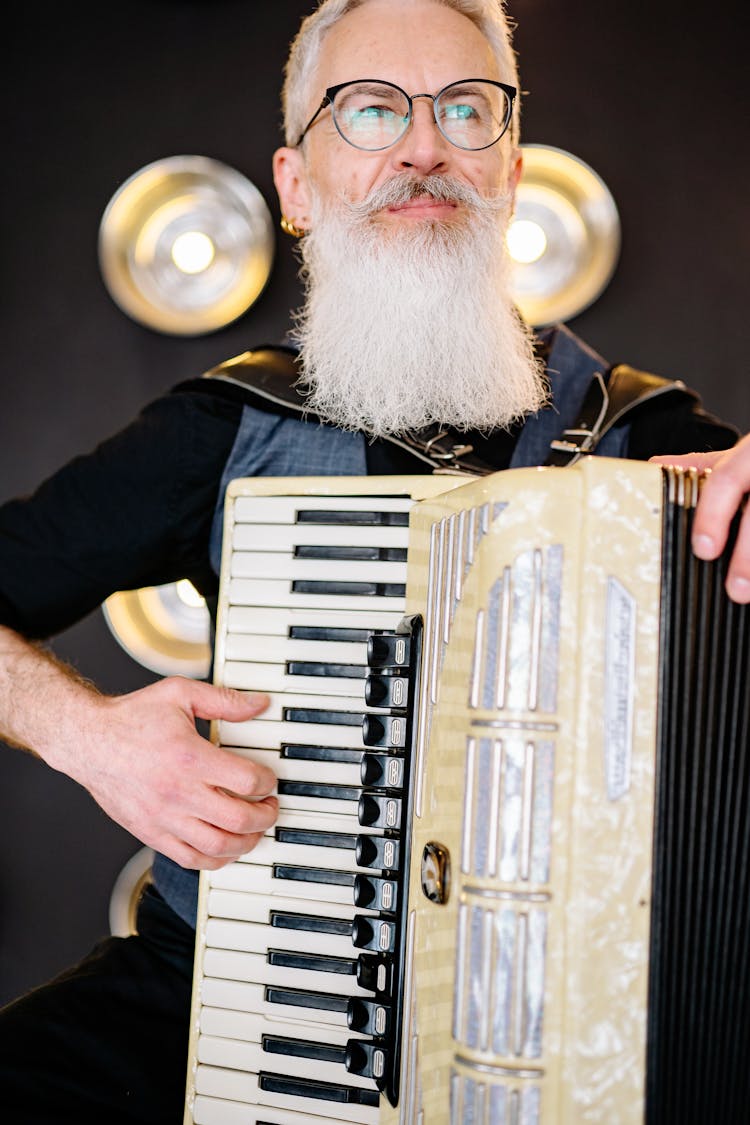 Bearded Man Playing A Piano Accordion