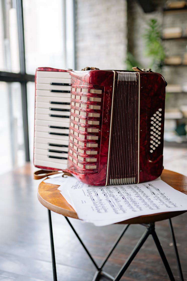 A Red Accordion On A Table