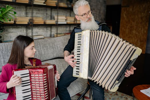 A young girl and her instructor playing accordions during a music lesson indoors.
