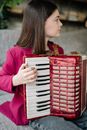 A Girl Playing an Accordion