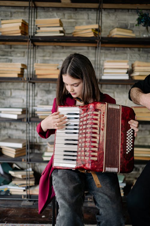 A Girl Playing an Accordion