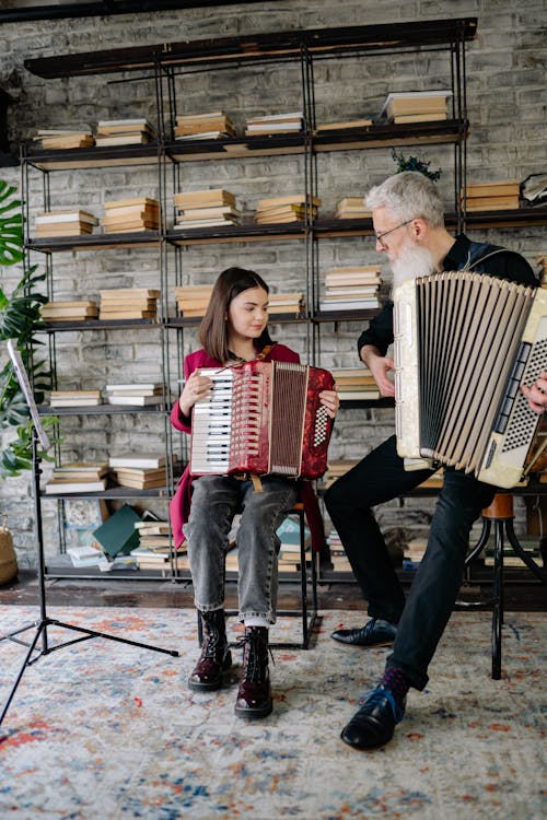 A Man and a Girl Playing Accordions