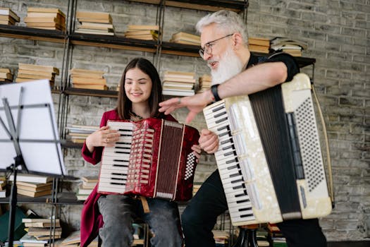 Adult teaching a child accordion in a book-filled room.