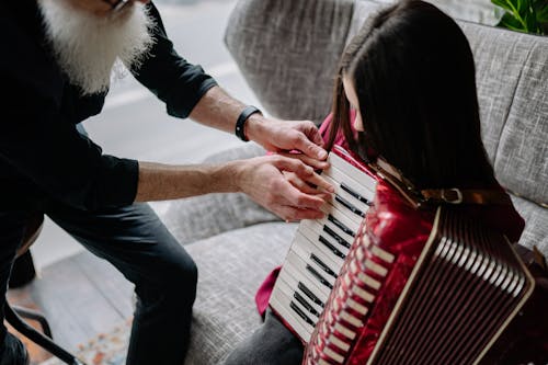 A Girl Playing an Accordion