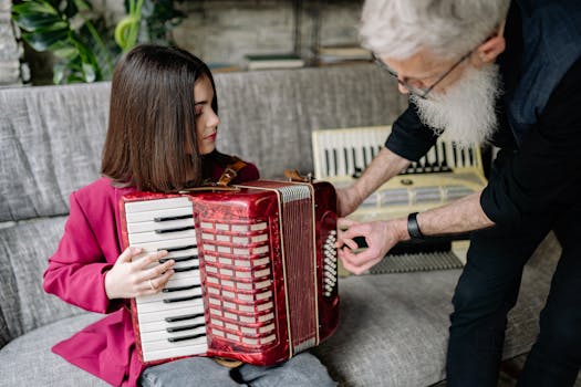 A child playing an accordion under the guidance of a teacher indoors.