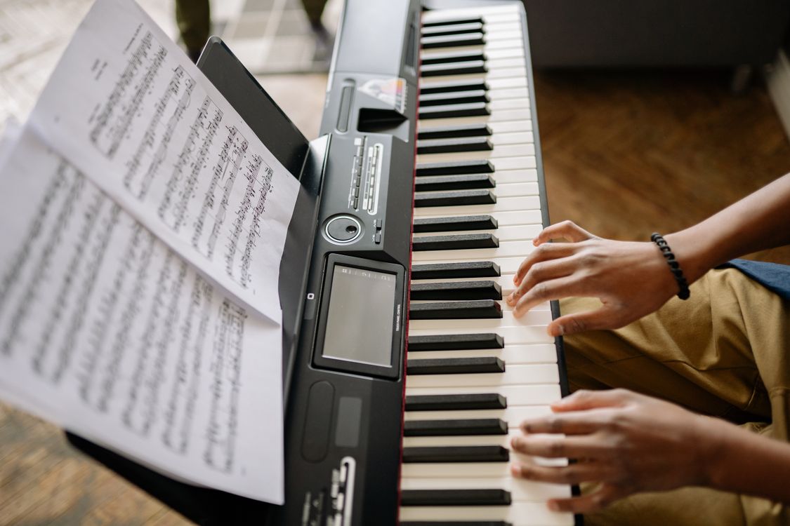 Person Playing Piano With Musical Notes · Free Stock Photo