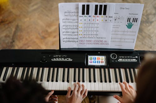 People Playing Piano Together