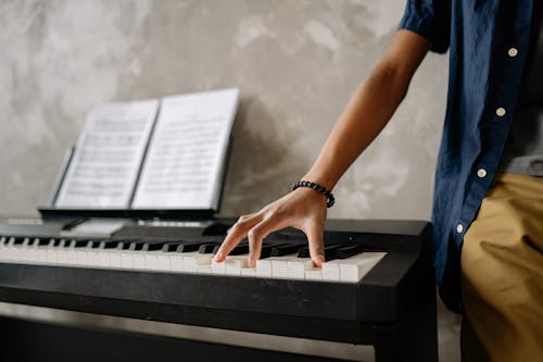 Free Fingers on Piano Notes Stock Photo