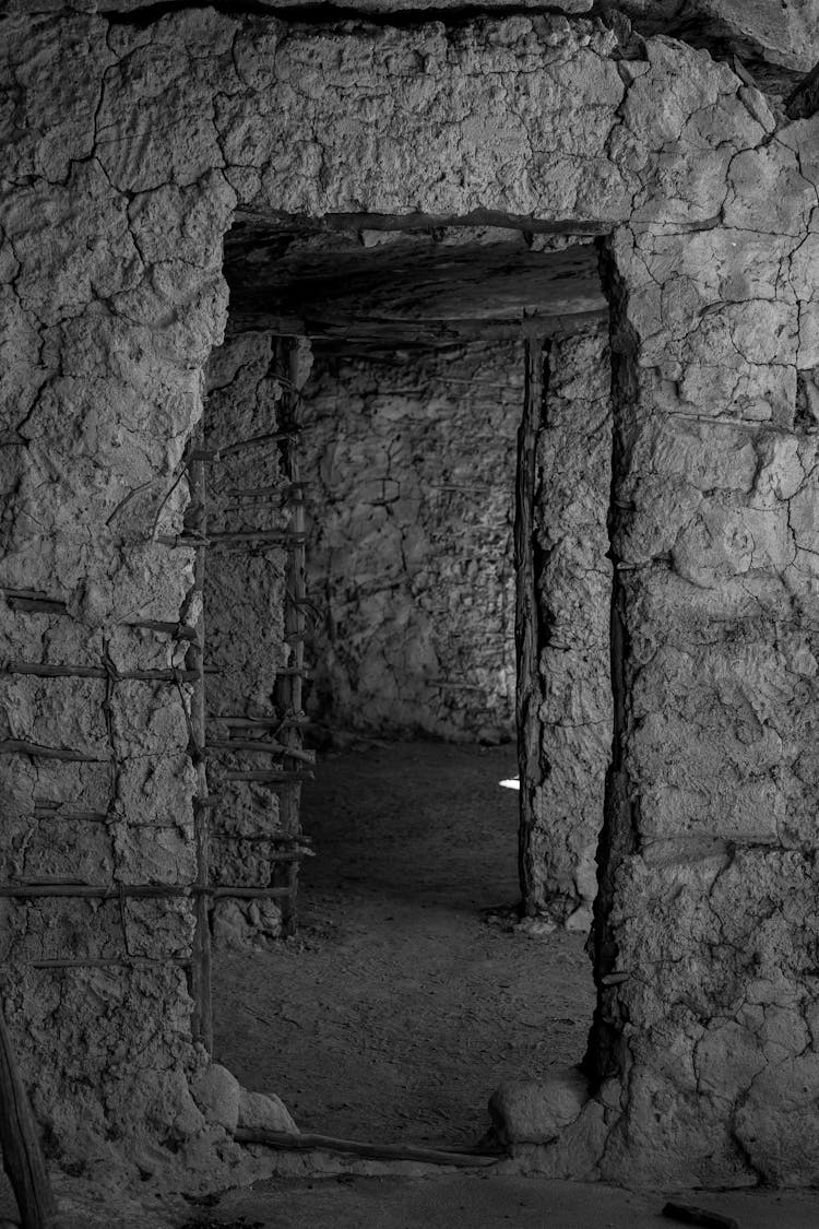 Black And White Shot Of Interior Of A Mud House 