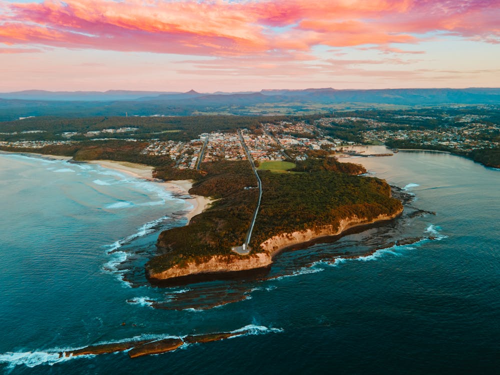 Clouds over Town and Forest on Sea Shore