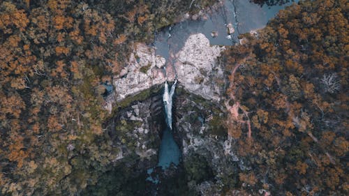 Free Aerial View of a Waterfall in the Forest Stock Photo