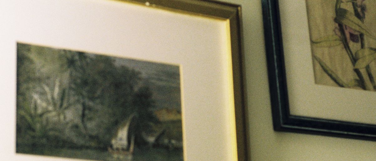 Framed pictures arranged in a level gallery wall