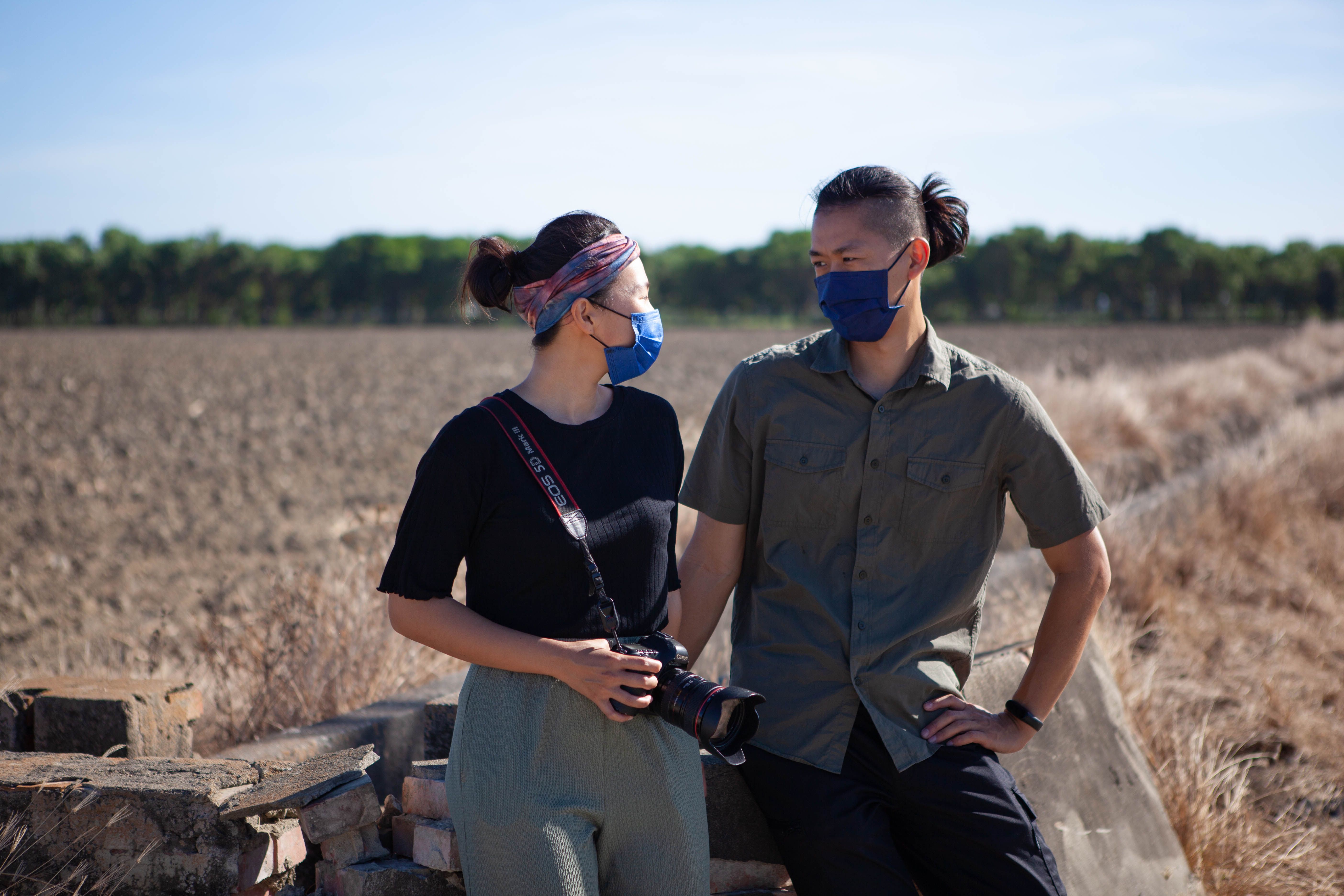 A Man and a Woman in a Brown Grass Field · Free Stock Photo
