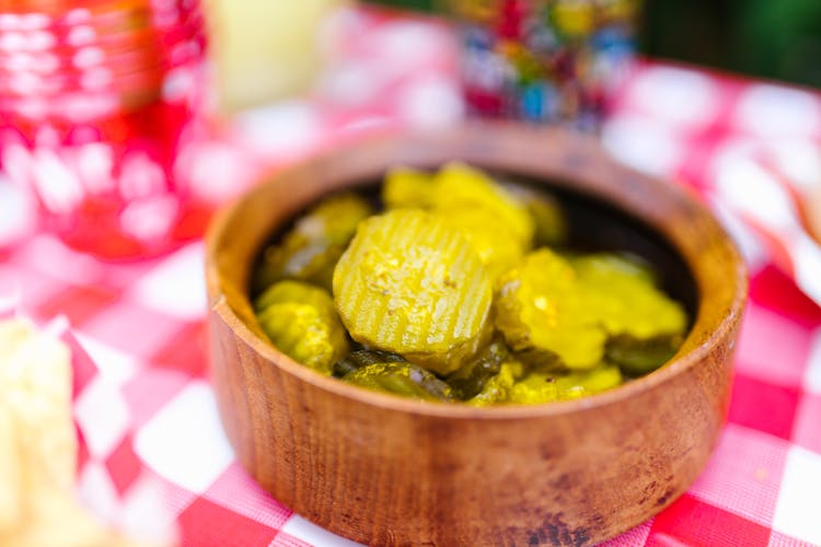 Pickled Cucumber In Brown Wooden Bowl