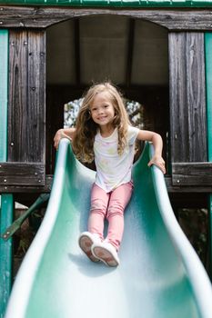 A Girl in White Shirt Sliding 