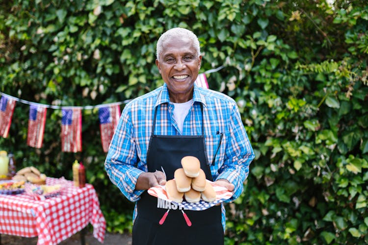 Man Holding Hotdog Sandwich Buns