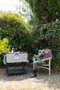 Man Sitting on a Chair Beside an Ice Box