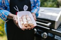 Person Holding Brown Bread With Ham and Cheese