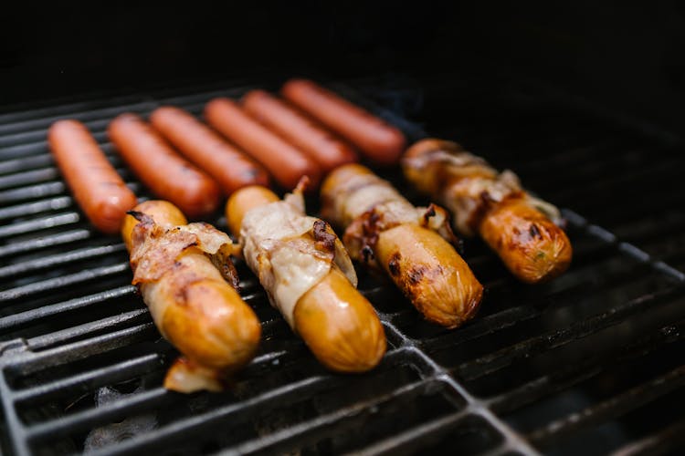 Hotdogs And Bacon On The Griller