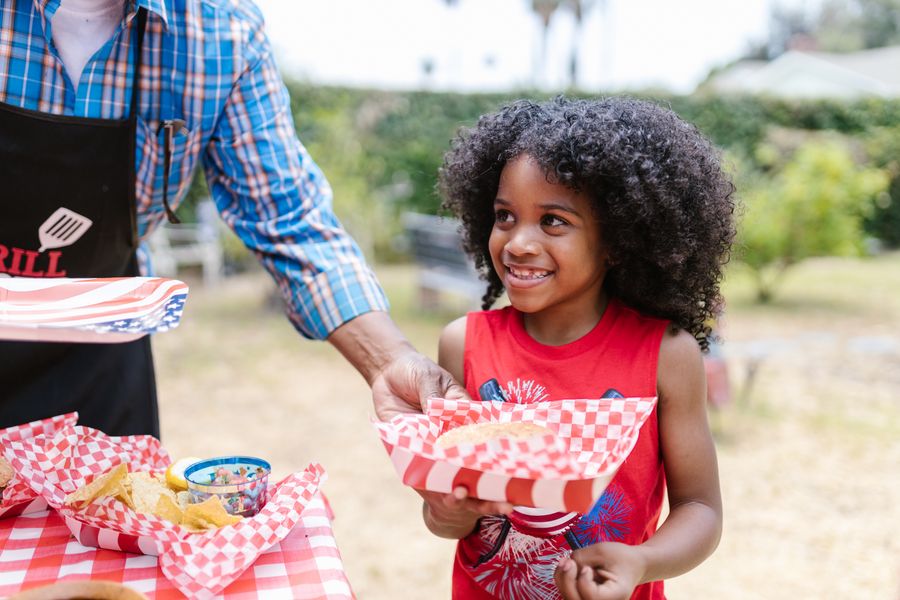 A child at a neighborhood community cookout