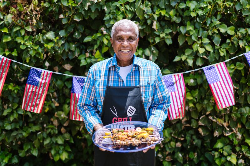 Grilling meat outdoors for a festive gathering