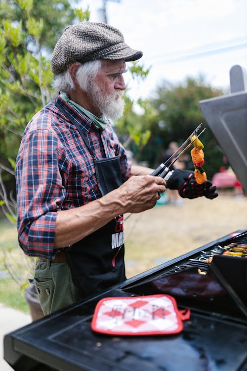 Elderly Man using Griller 