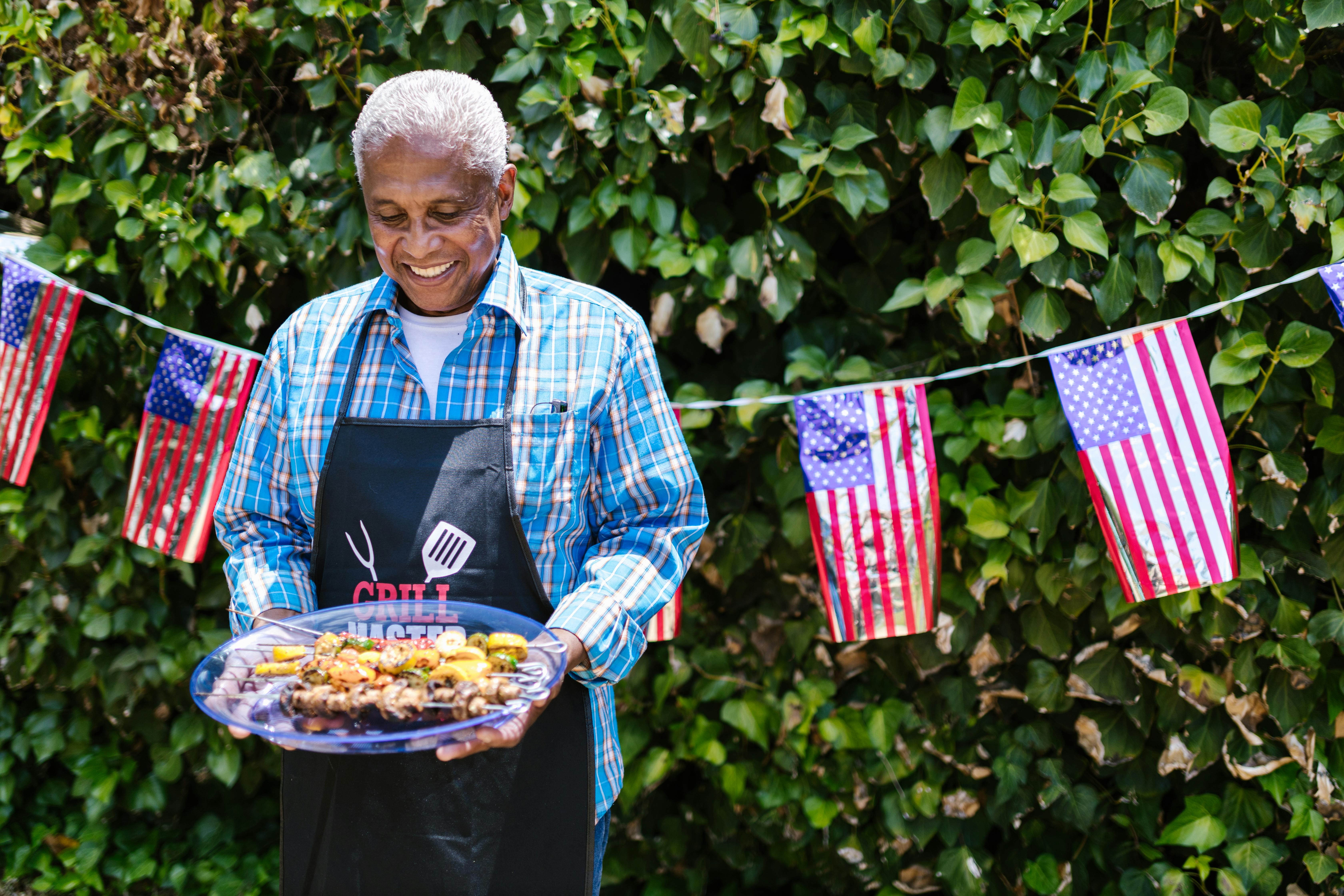 man holding a plate with food