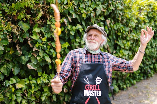 Elderly man enjoying grilling in backyard with skewer and apron.