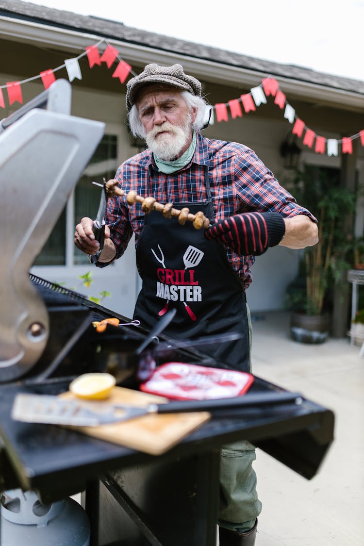 Man Grilling Barbeques