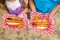 Woman in Teal Tank Top Holding Burger