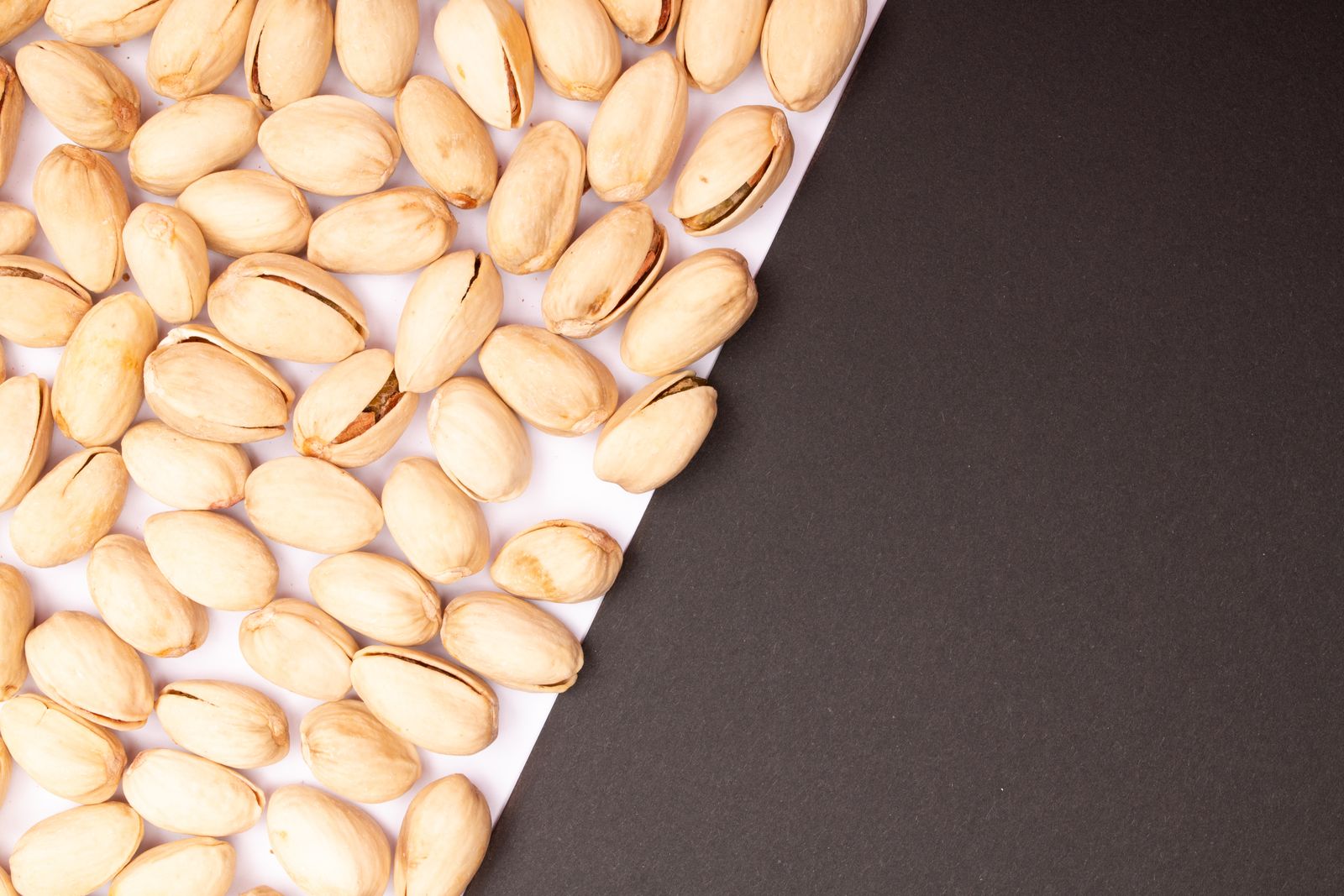 Pistachio nuts in a bowl close-up