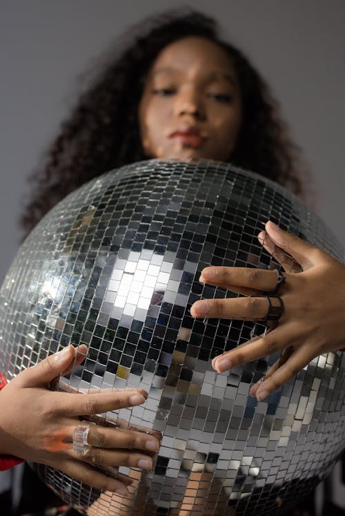 Woman Holding Disco Ball