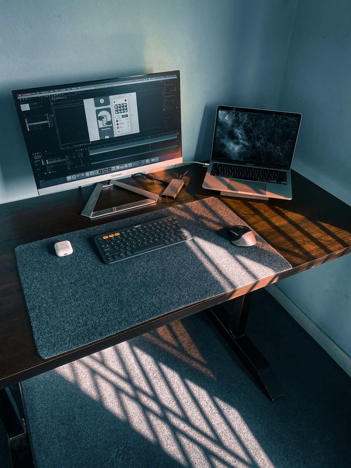 A Computer Beside A Laptop On A Table Free Stock Photo A Computer Beside A Laptop On A Table Free Stock Photo