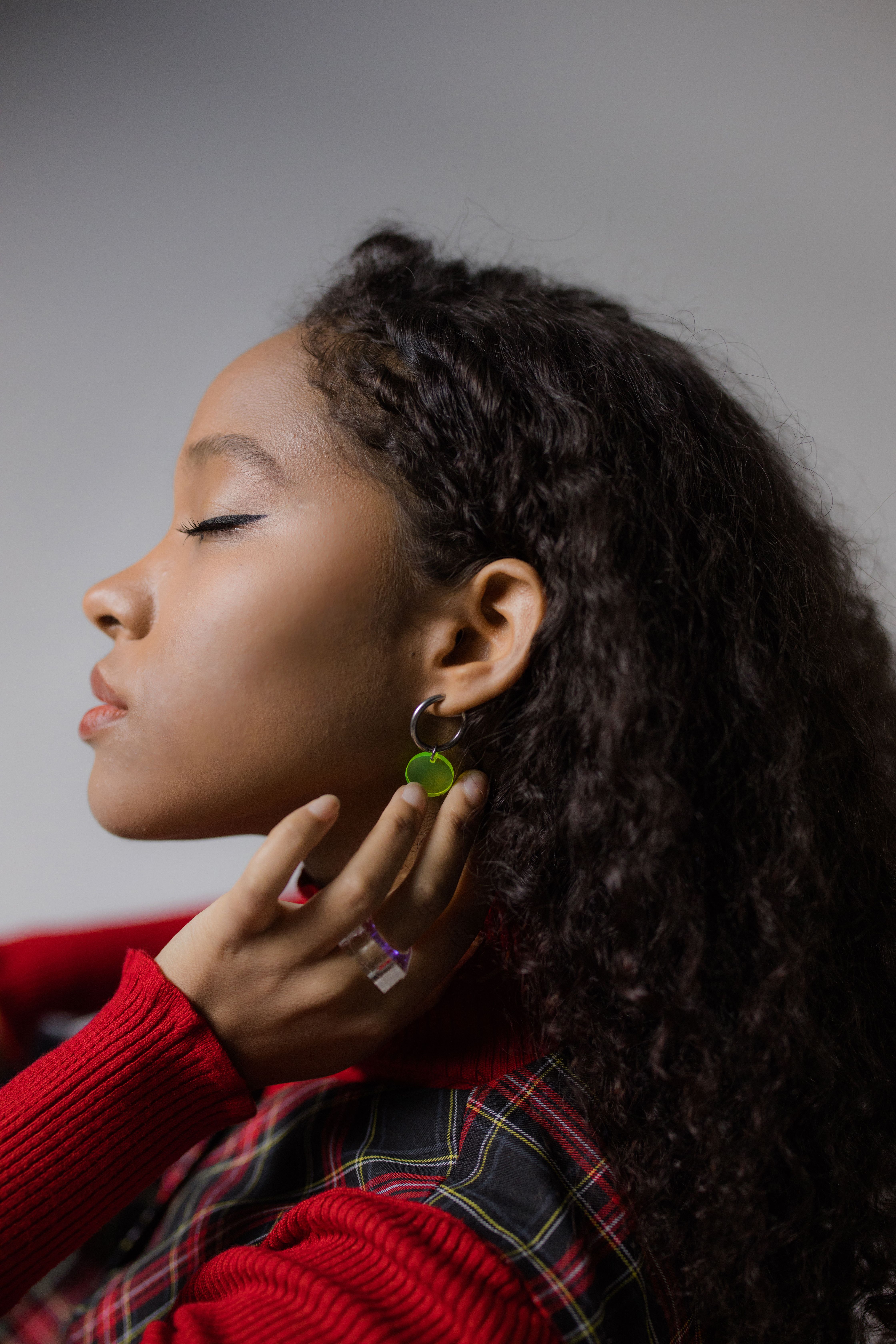 A Woman Holding Her Neck · Free Stock Photo