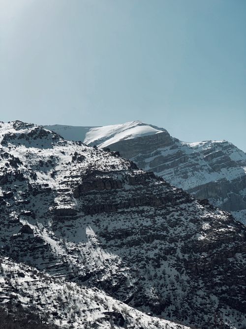 Free A stunning view of snow-covered peaks in Sharbazher, showcasing nature's beauty. Stock Photo