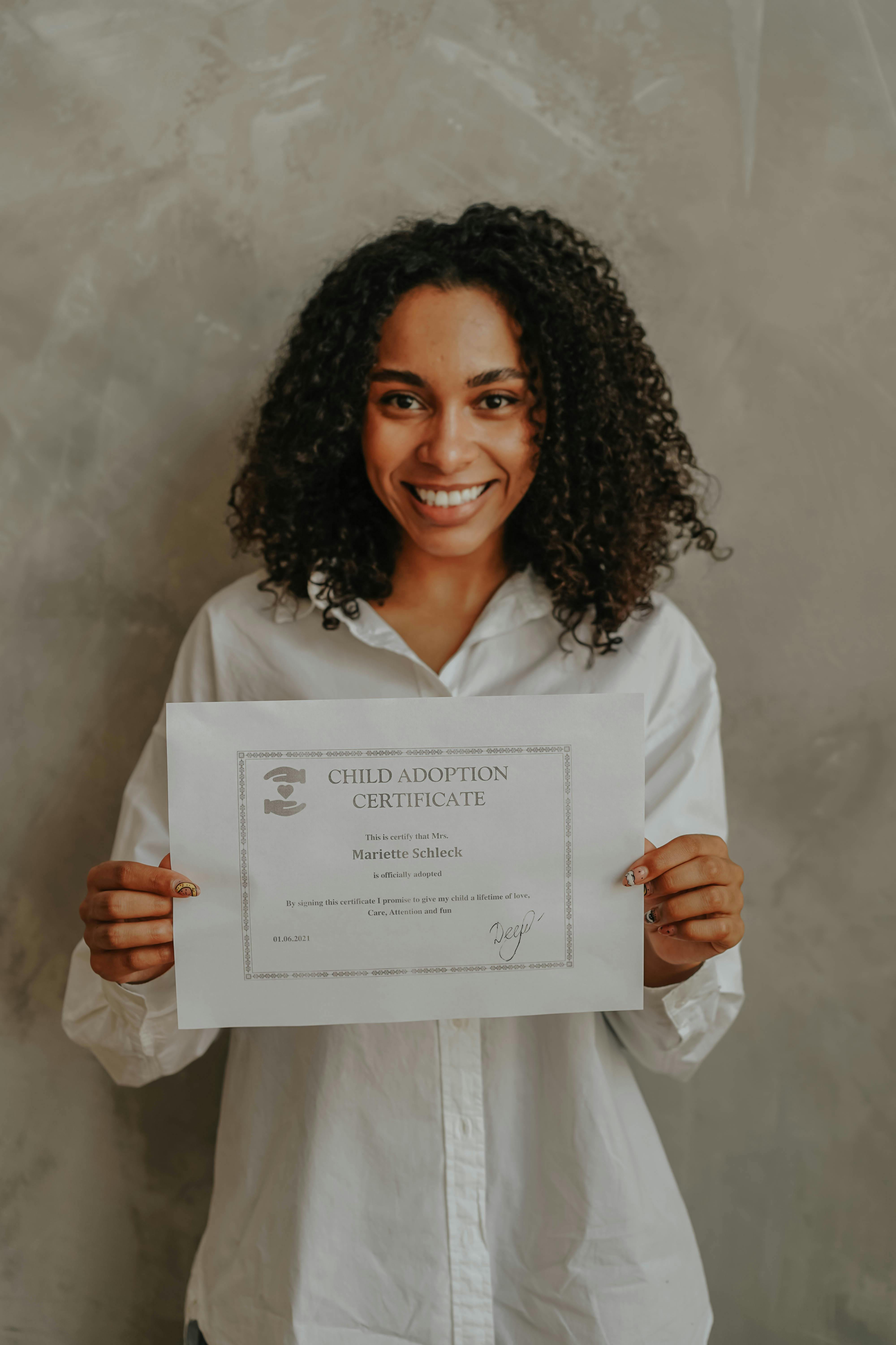 a woman holding a paper