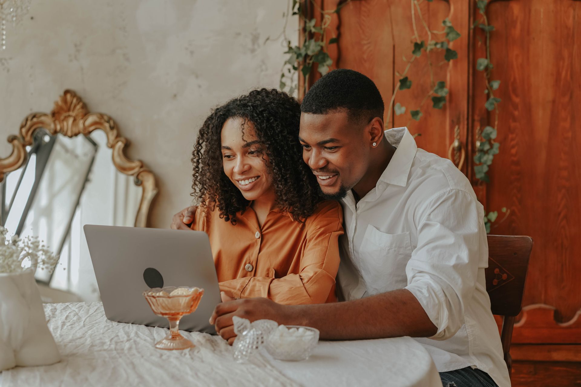 A Couple Using a Laptop