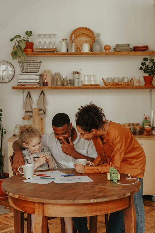 Free A Family Sitting at the Table Stock Photo