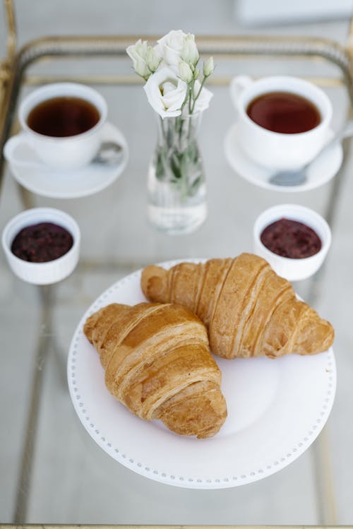 Close-Up Shot of Croissants on a White Plate