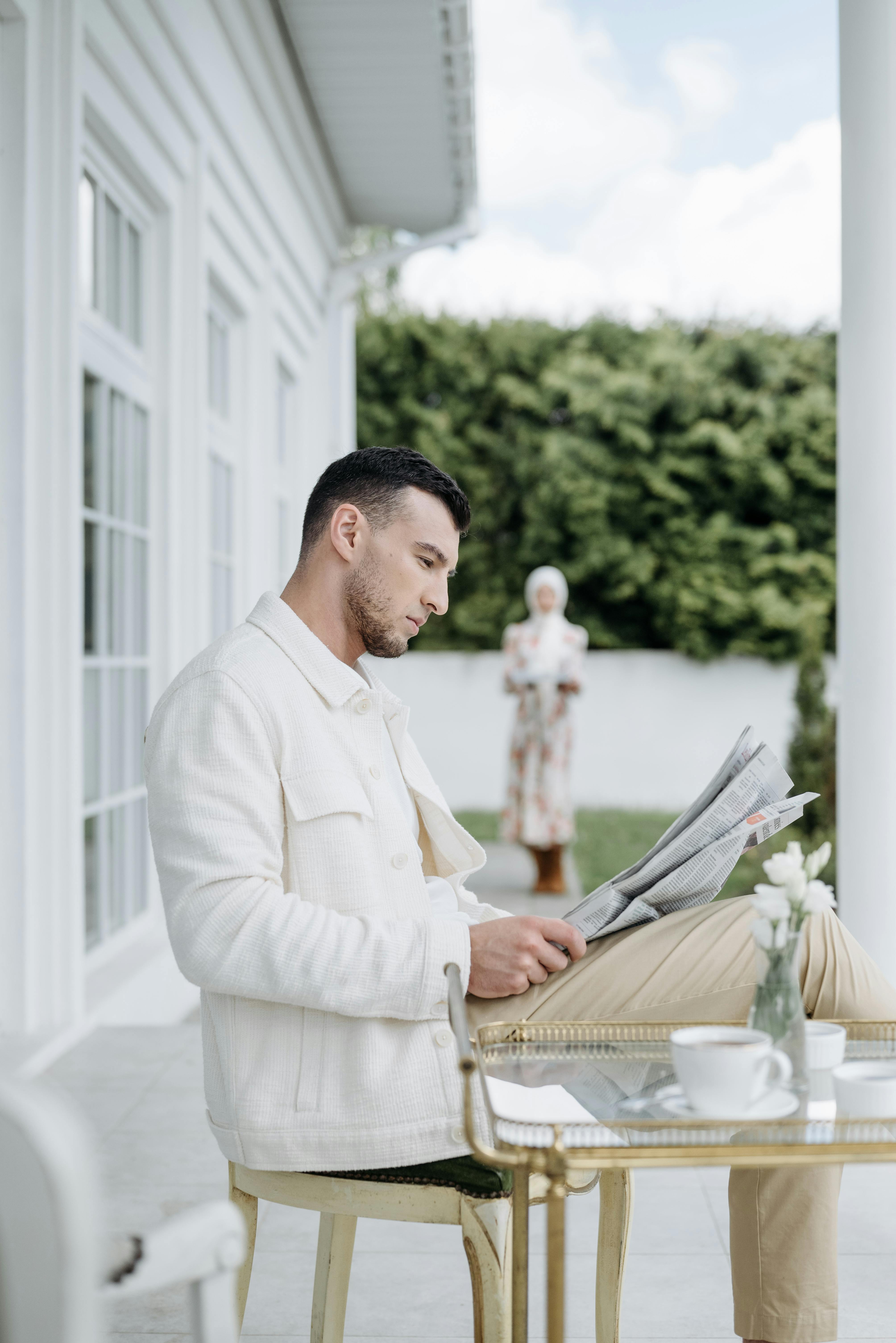 man reading newspaper