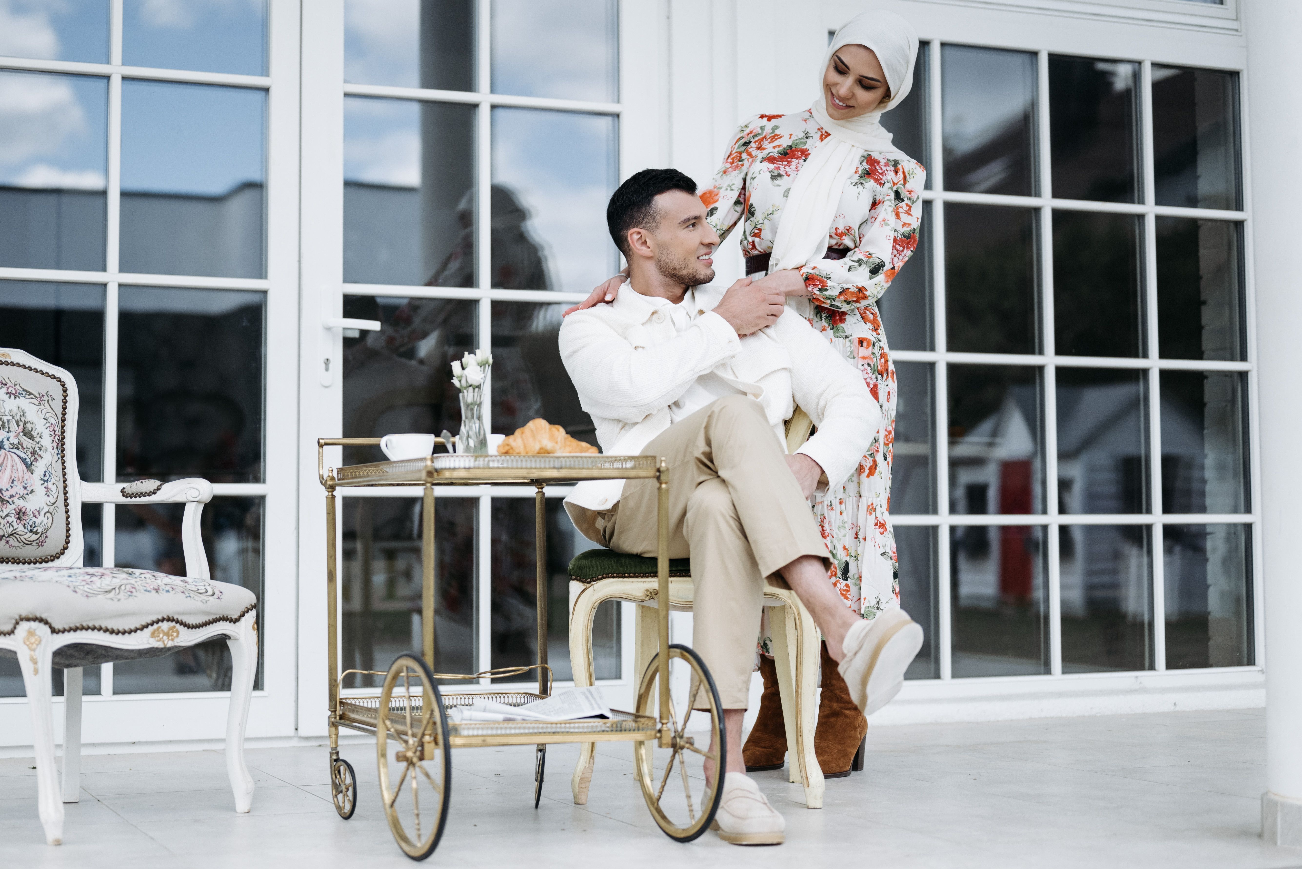A loving couple in a modern setting, expressing tenderness and affection.