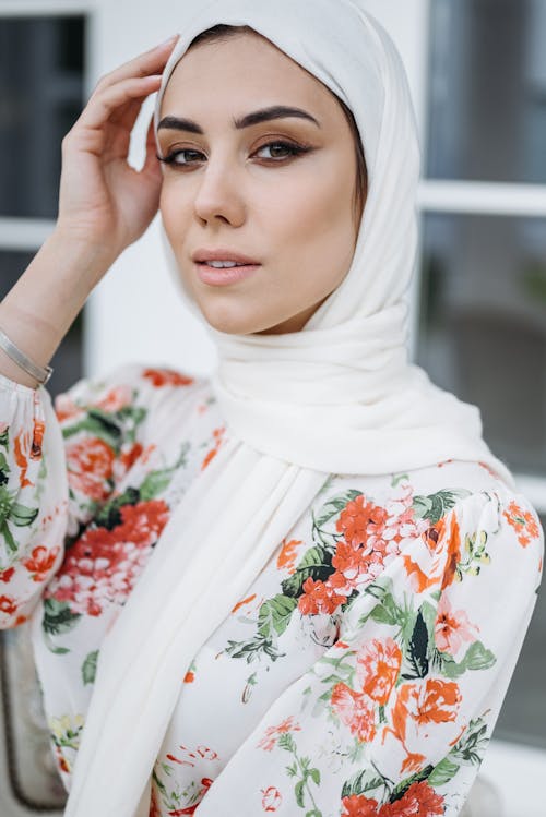 Woman in Floral Dress and Hijab Posing
